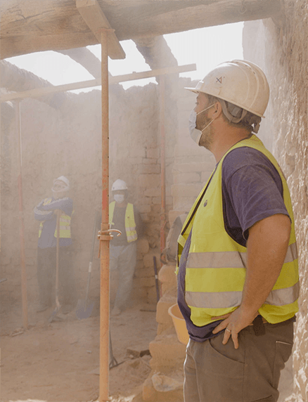 A person working at an archaeological site