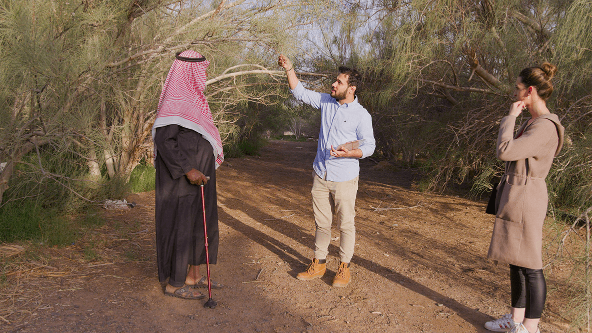 A man showing a Moringa branch