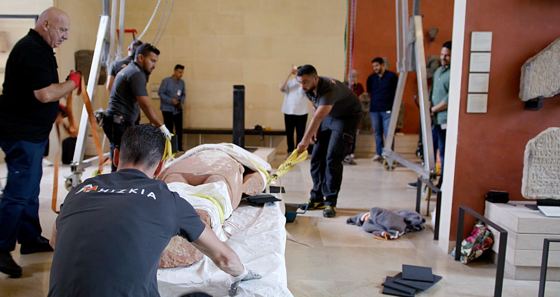 A group setting up the exhibition
